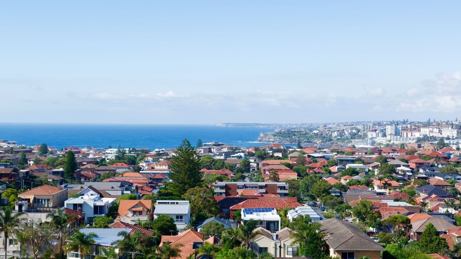 Coastal Australian housing with rooftop solar among the roofs